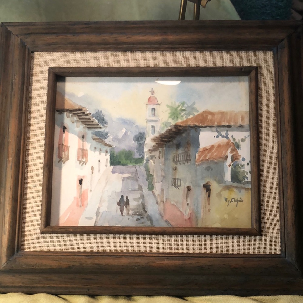 Watercolor of a Mediterranean street scene with spire as central focal point